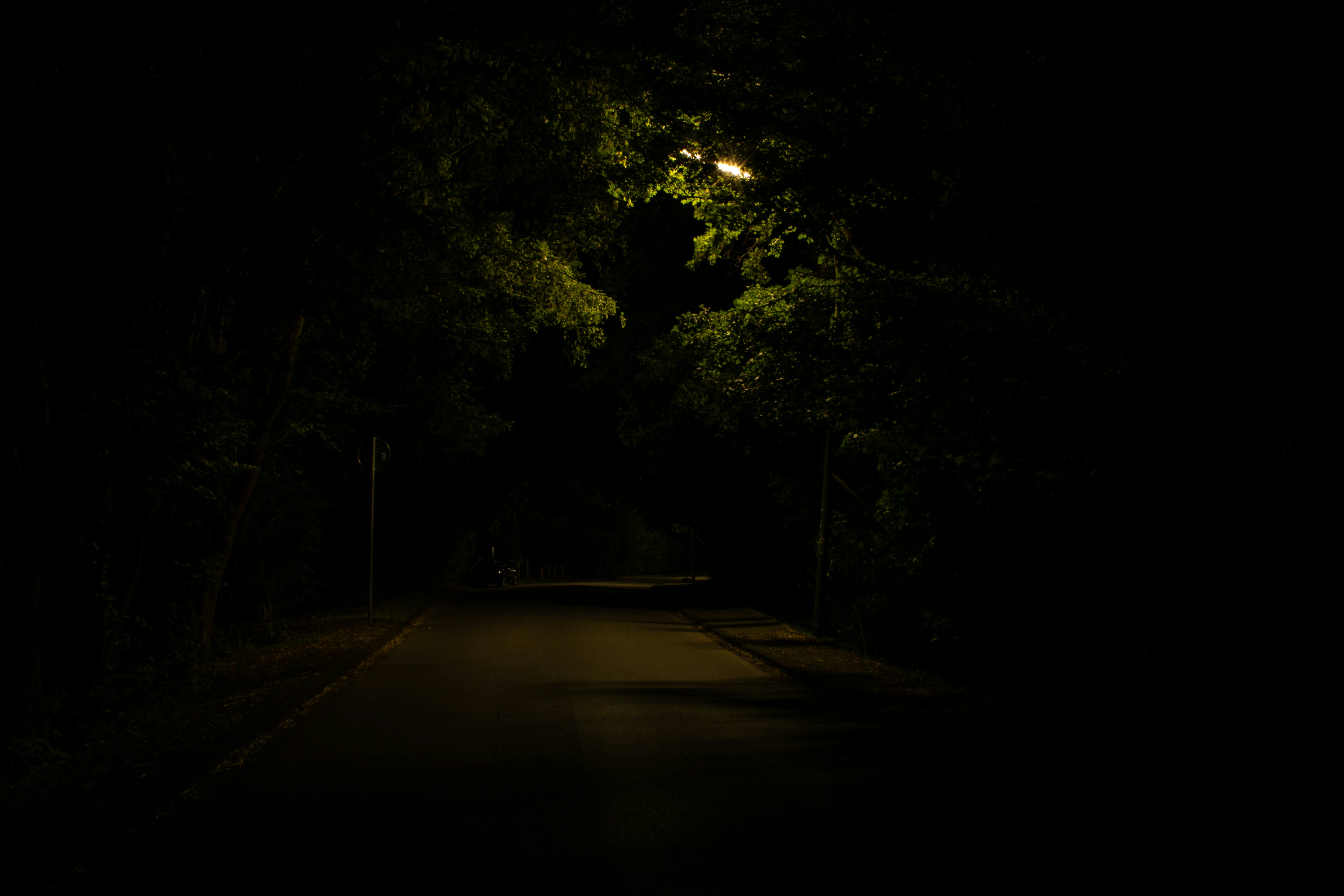 Dimly lit city street at night